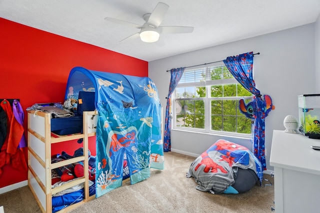 bedroom featuring carpet floors, baseboards, and a ceiling fan