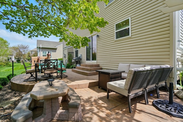 view of patio with grilling area and outdoor dining area