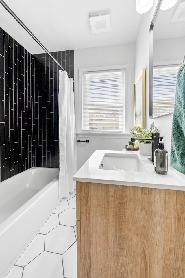 full bathroom with shower / bath combo, vanity, and tile patterned floors