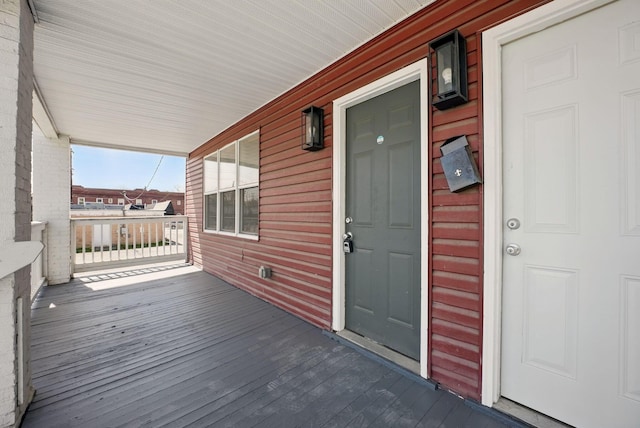 wooden terrace with a porch