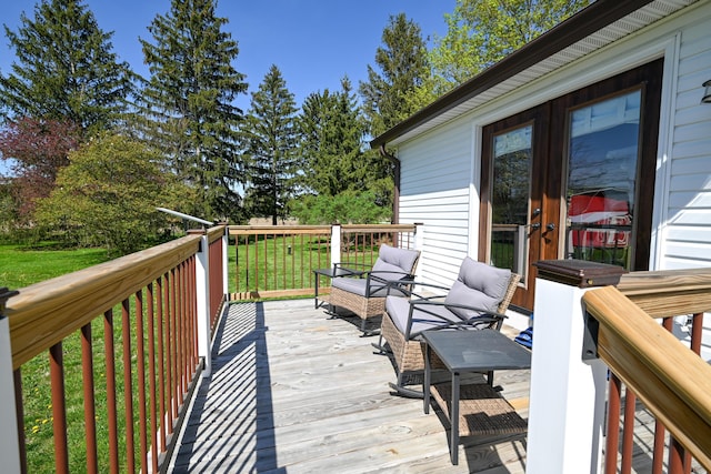 wooden deck featuring french doors