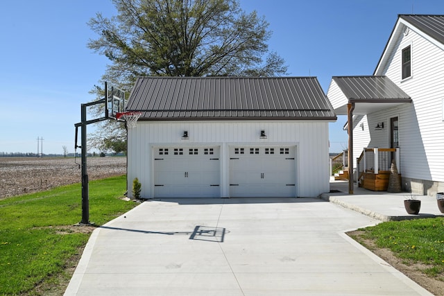 garage with concrete driveway