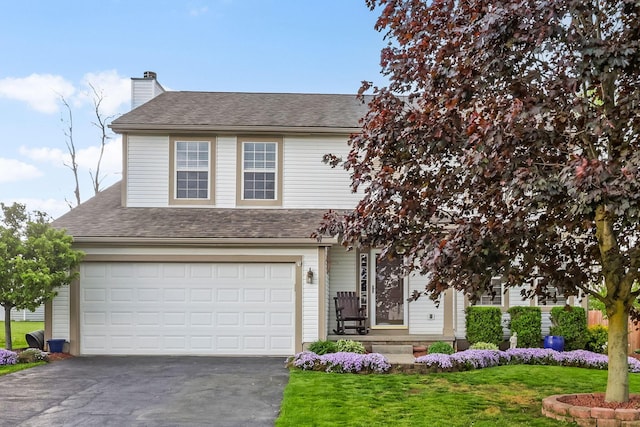 1616 Saddlebrook Dr, Heath, OH 43056 - view of front of home with a chimney, roof with shingles, a front yard, aphalt driveway, and an attached garage