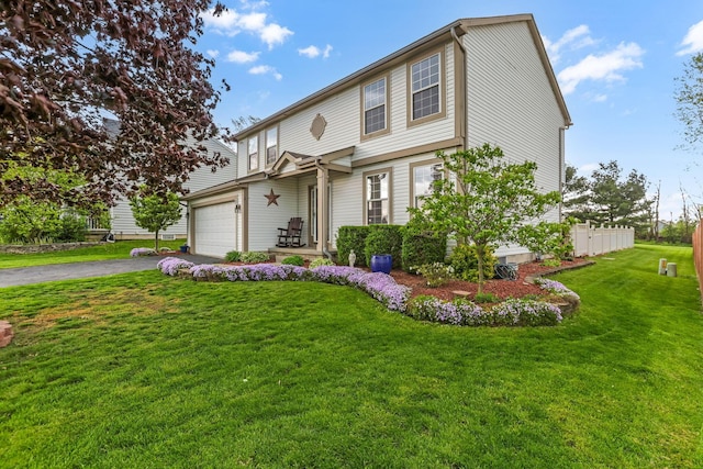 1616 Saddlebrook Dr, Heath, OH 43056 - traditional-style home featuring an attached garage, aphalt driveway, and a front yard