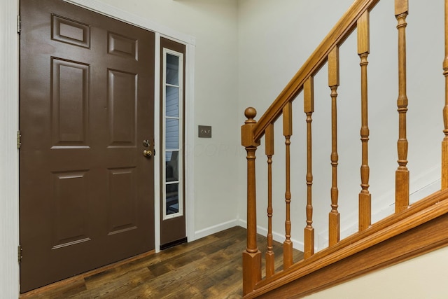 1616 Saddlebrook Dr, Heath, OH 43056 - entryway with dark wood-type flooring, baseboards, and stairway