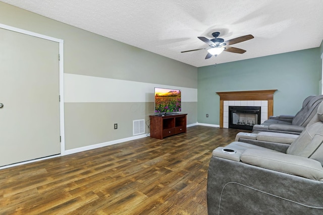 1616 Saddlebrook Dr, Heath, OH 43056 - living area with ceiling fan, visible vents, a tile fireplace, wood finished floors, and baseboards