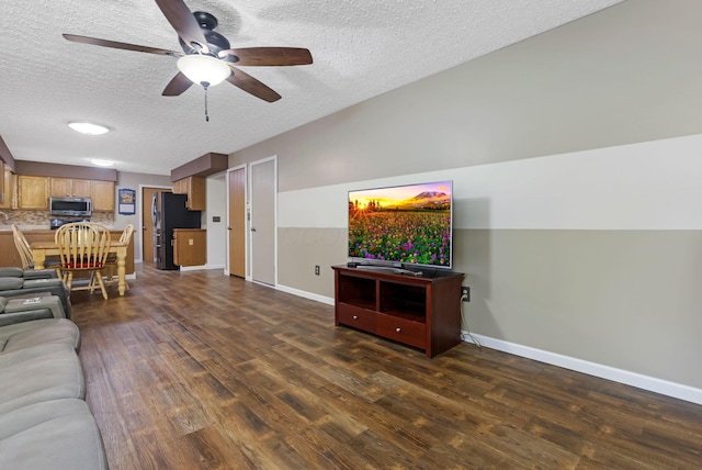 1616 Saddlebrook Dr, Heath, OH 43056 - living area with a ceiling fan, a textured ceiling, dark wood finished floors, and baseboards