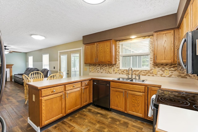1616 Saddlebrook Dr, Heath, OH 43056 - kitchen with a sink, dishwasher, a textured ceiling, electric stove, and a peninsula