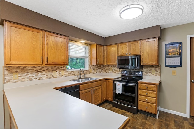 1616 Saddlebrook Dr, Heath, OH 43056 - kitchen with light countertops, appliances with stainless steel finishes, a sink, and dark wood finished floors