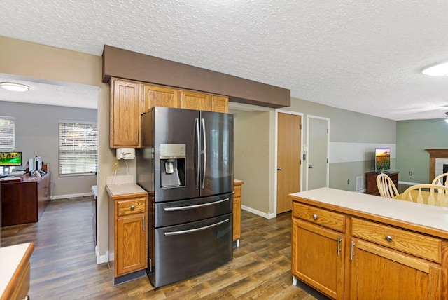 1616 Saddlebrook Dr, Heath, OH 43056 - kitchen with light countertops, a textured ceiling, dark wood-style floors, and stainless steel fridge with ice dispenser