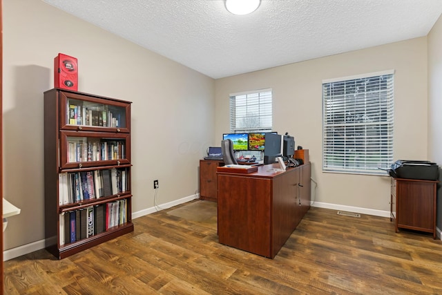 1616 Saddlebrook Dr, Heath, OH 43056 - home office with baseboards, a textured ceiling, and dark wood-style flooring
