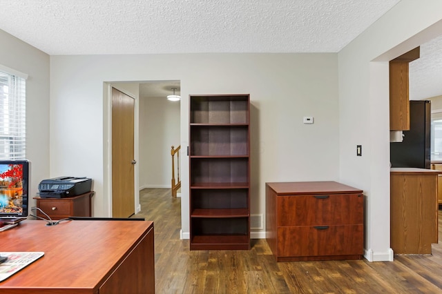 1616 Saddlebrook Dr, Heath, OH 43056 - office featuring baseboards, a textured ceiling, and dark wood-type flooring