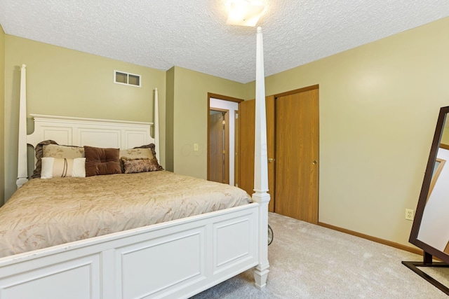 1616 Saddlebrook Dr, Heath, OH 43056 - bedroom with a closet, light colored carpet, a textured ceiling, and visible vents
