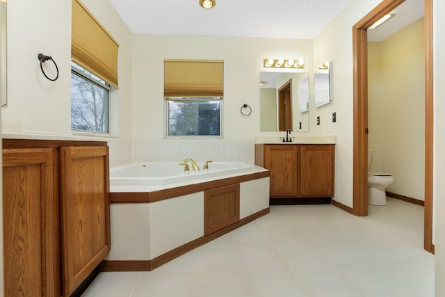1616 Saddlebrook Dr, Heath, OH 43056 - full bathroom featuring vanity, a garden tub, and toilet