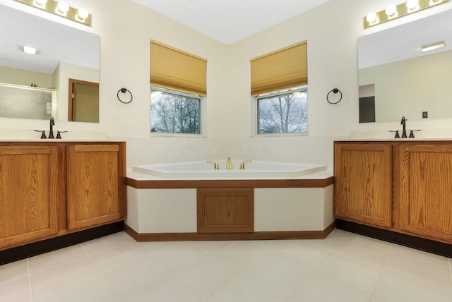 1616 Saddlebrook Dr, Heath, OH 43056 - full bath with a sink, a stall shower, a garden tub, and a wealth of natural light