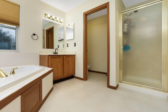 1616 Saddlebrook Dr, Heath, OH 43056 - bathroom with a garden tub, tile patterned flooring, a shower stall, vanity, and toilet