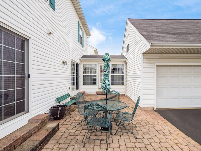 view of patio / terrace featuring an attached garage