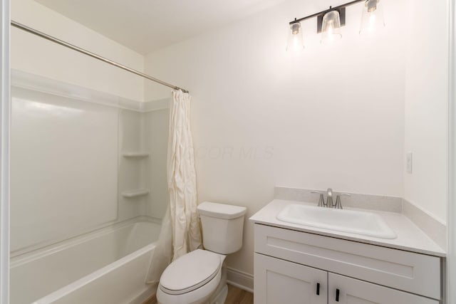 full bathroom featuring shower / bath combo, toilet, and vanity