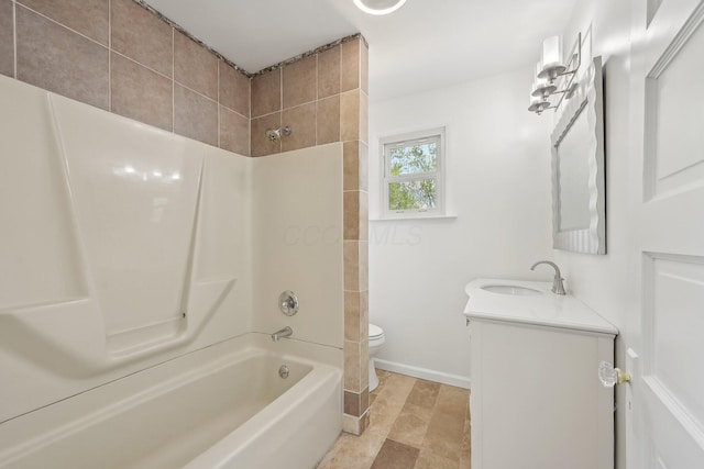 bathroom featuring baseboards, bathing tub / shower combination, toilet, and vanity