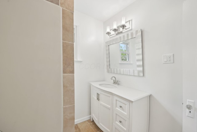 bathroom with vanity and baseboards