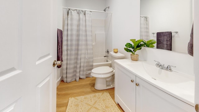 bathroom featuring shower / tub combo, wood finished floors, vanity, and toilet