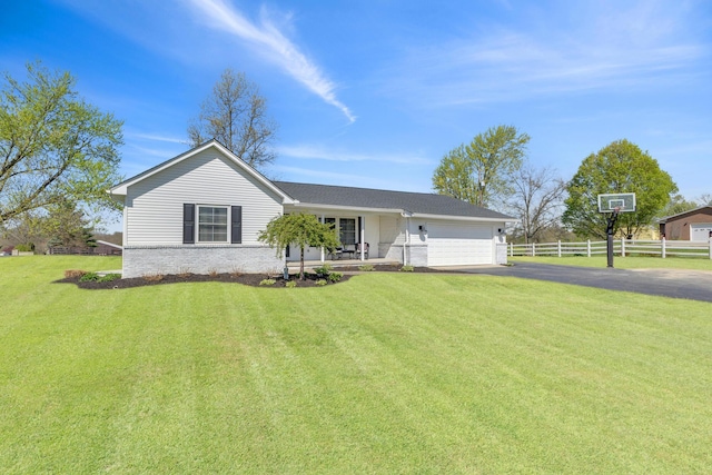 757 State Rte 61, Sunbury, OH 43074 - single story home featuring a porch, fence, a garage, driveway, and a front yard