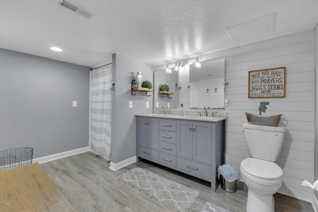 757 State Rte 61, Sunbury, OH 43074 - full bathroom featuring toilet, a sink, visible vents, and wood finished floors