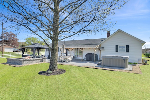 757 State Rte 61, Sunbury, OH 43074 - rear view of property featuring a patio, a gazebo, a chimney, a hot tub, and a yard