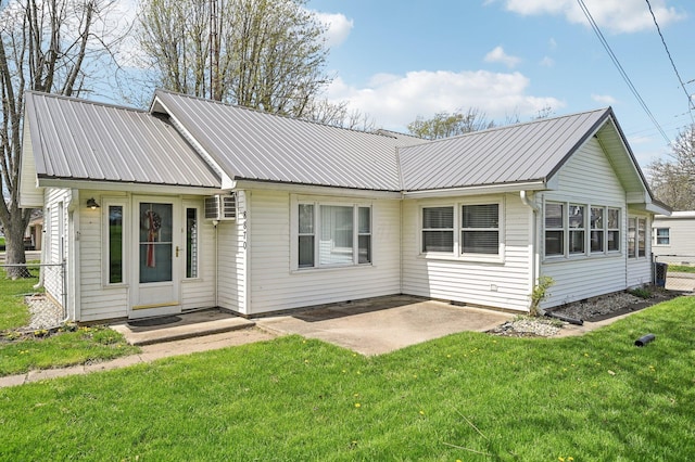 8870 College St, Lakeview, OH 43331 - rear view of house with fence, a patio area, a yard, and metal roof