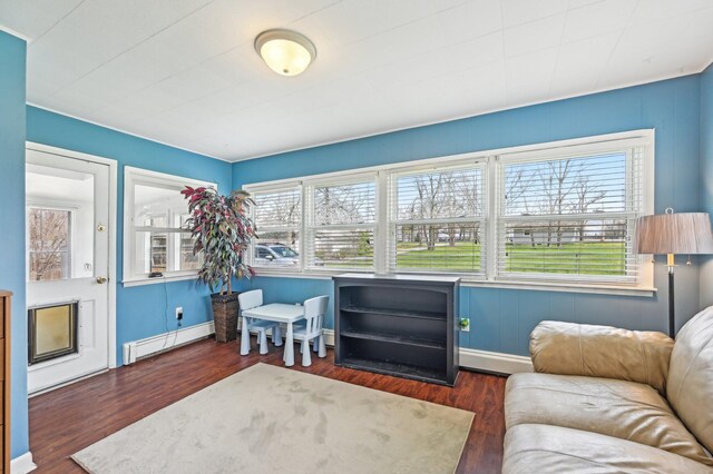 8870 College St, Lakeview, OH 43331 - sitting room with a baseboard heating unit, baseboards, and wood finished floors