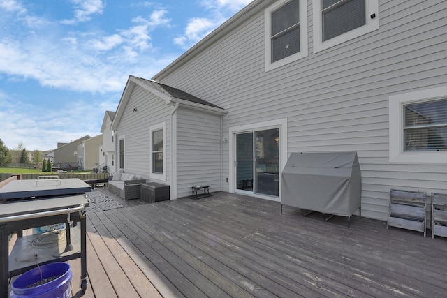 wooden deck featuring an outdoor hangout area