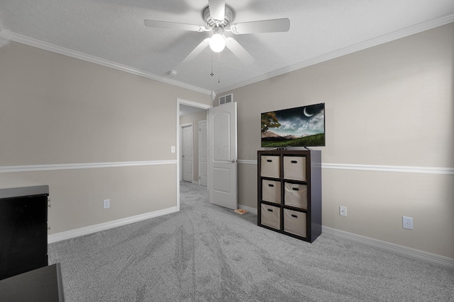 unfurnished bedroom with baseboards, crown molding, carpet flooring, and visible vents