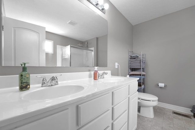 full bathroom featuring visible vents, a sink, double vanity, and a stall shower
