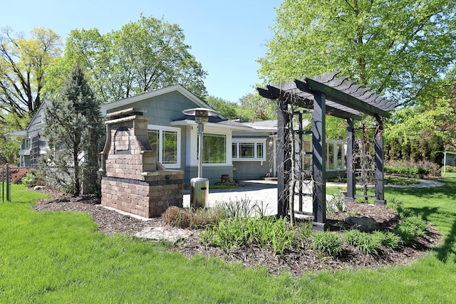 exterior space with a patio, a pergola, and a yard