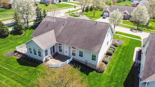 birds eye view of property with a residential view