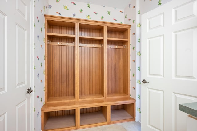 mudroom featuring wallpapered walls