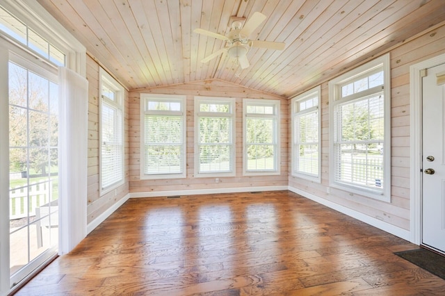 unfurnished sunroom with wood ceiling, wood walls, hardwood / wood-style flooring, and vaulted ceiling