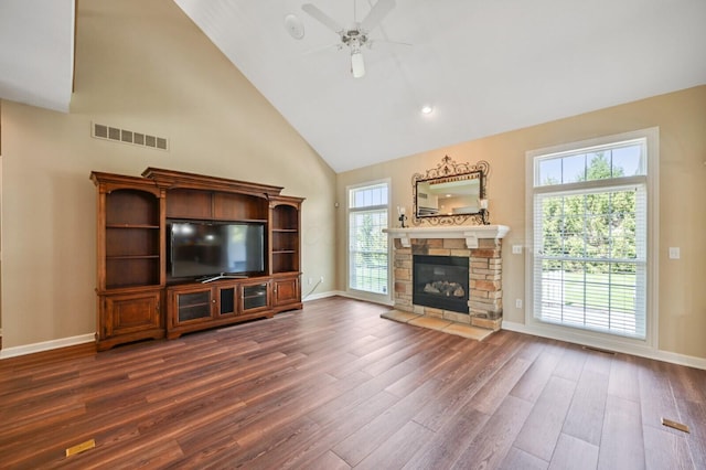 unfurnished living room featuring visible vents, a ceiling fan, high vaulted ceiling, and dark wood finished floors