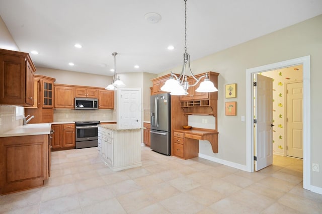 kitchen with brown cabinets, decorative backsplash, glass insert cabinets, appliances with stainless steel finishes, and a center island