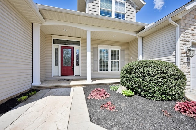 view of exterior entry featuring a porch