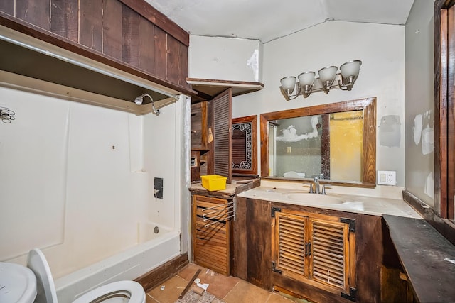 full bath featuring vanity, shower / bathtub combination, tile patterned floors, toilet, and vaulted ceiling