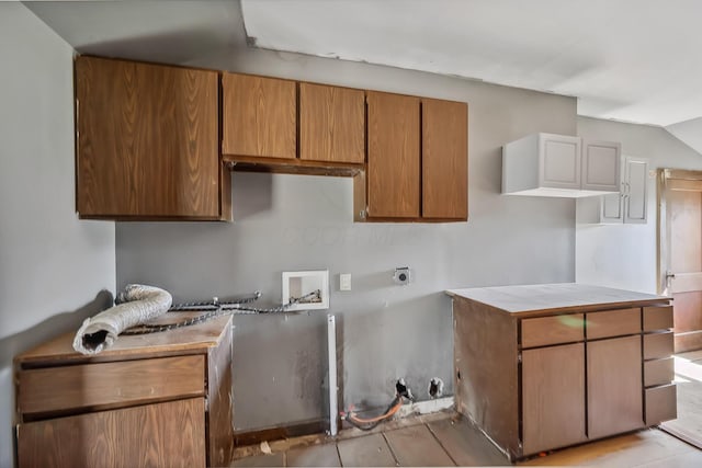 kitchen featuring brown cabinets