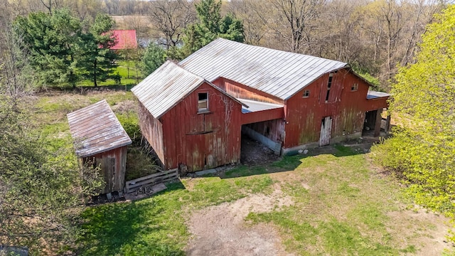 view of barn with a lawn