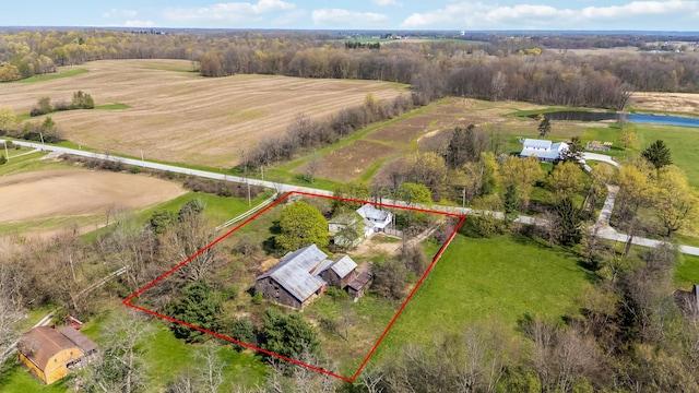birds eye view of property with a rural view and a water view