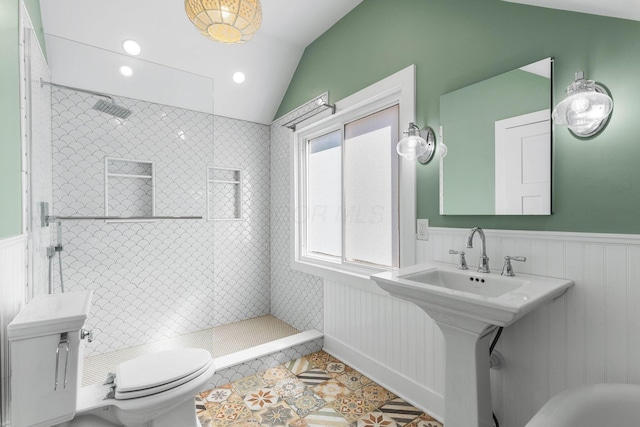 250 E Park St, Westerville, OH 43081 - full bathroom with tiled shower, toilet, vaulted ceiling, tile patterned flooring, and wainscoting