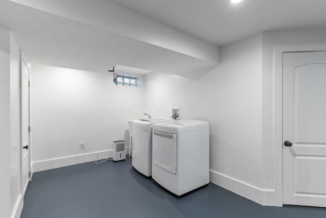250 E Park St, Westerville, OH 43081 - laundry room featuring washing machine and dryer, a textured ceiling, laundry area, and baseboards