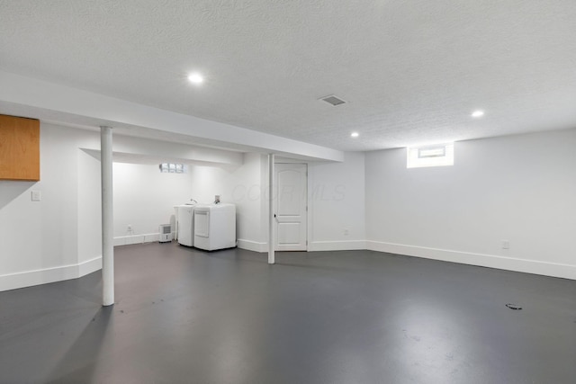 250 E Park St, Westerville, OH 43081 - basement with baseboards, recessed lighting, a textured ceiling, and washer and clothes dryer