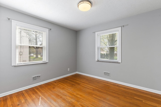 250 E Park St, Westerville, OH 43081 - spare room featuring plenty of natural light, visible vents, and baseboards