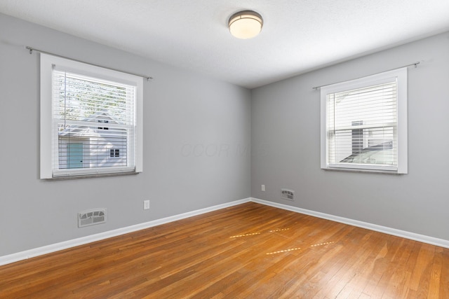 250 E Park St, Westerville, OH 43081 - unfurnished room with hardwood / wood-style floors, visible vents, and baseboards