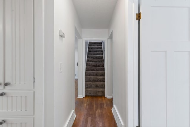 250 E Park St, Westerville, OH 43081 - hall featuring baseboards, a textured ceiling, stairs, and dark wood finished floors